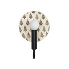 Edith ADA Sconce shown in Matte Black with a Black and Cream Floral Ceramic Canopy