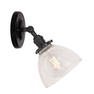 Grace Flush Sconce shown in Graphite Patina with a Gloss Black Ceramic canopy and Clear Glass shade