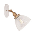 Grace Flush Sconce shown in Heirloom Brass with a Gloss White Ceramic canopy and Clear Glass shade