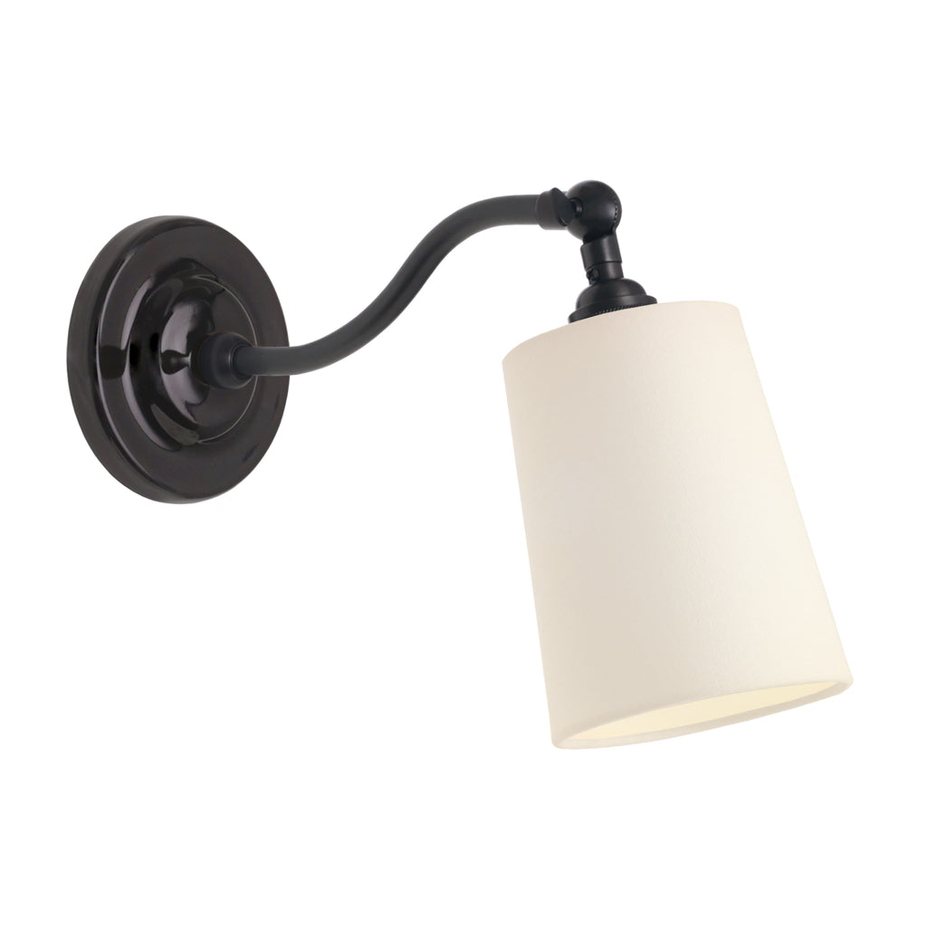 Grace Linen Sconce shown in Graphite Patina with a Gloss Black Ceramic canopy