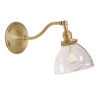 Grace Sconce shown in Brass with a Clear Glass shade