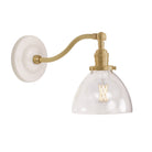 Grace Sconce shown in Brass with a Gloss White Ceramic canopy and a Clear Glass shade