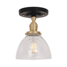 Grace Surface shown in Brass with a Gloss Black Ceramic canopy and Clear Glass shade