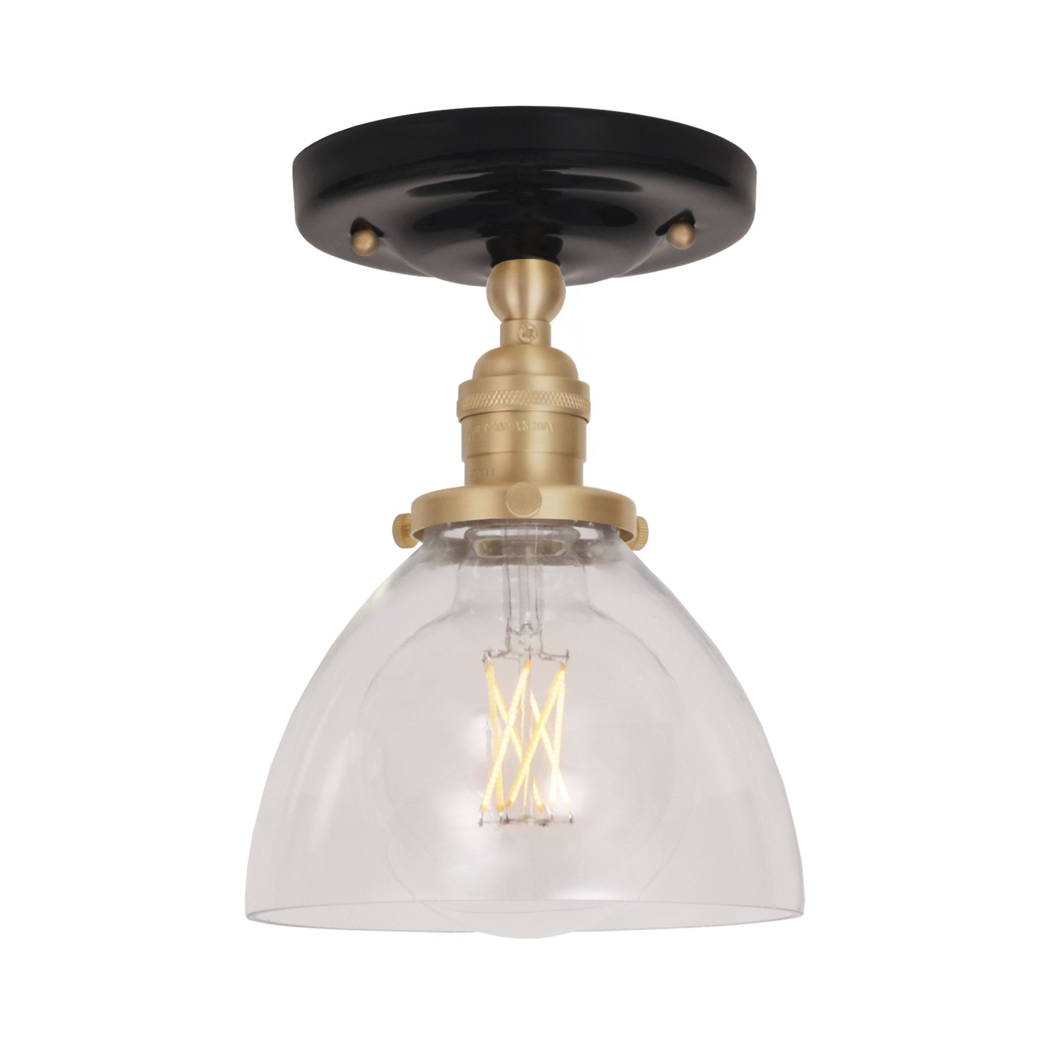 Grace Surface shown in Brass with a Gloss Black Ceramic canopy and Clear Glass shade