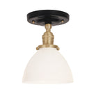 Grace Surface shown in Brass with a Gloss Black Ceramic canopy and Opal Glass shade