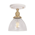 Grace Surface shown in Brass with a Gloss White Ceramic canopy and Clear Glass shade