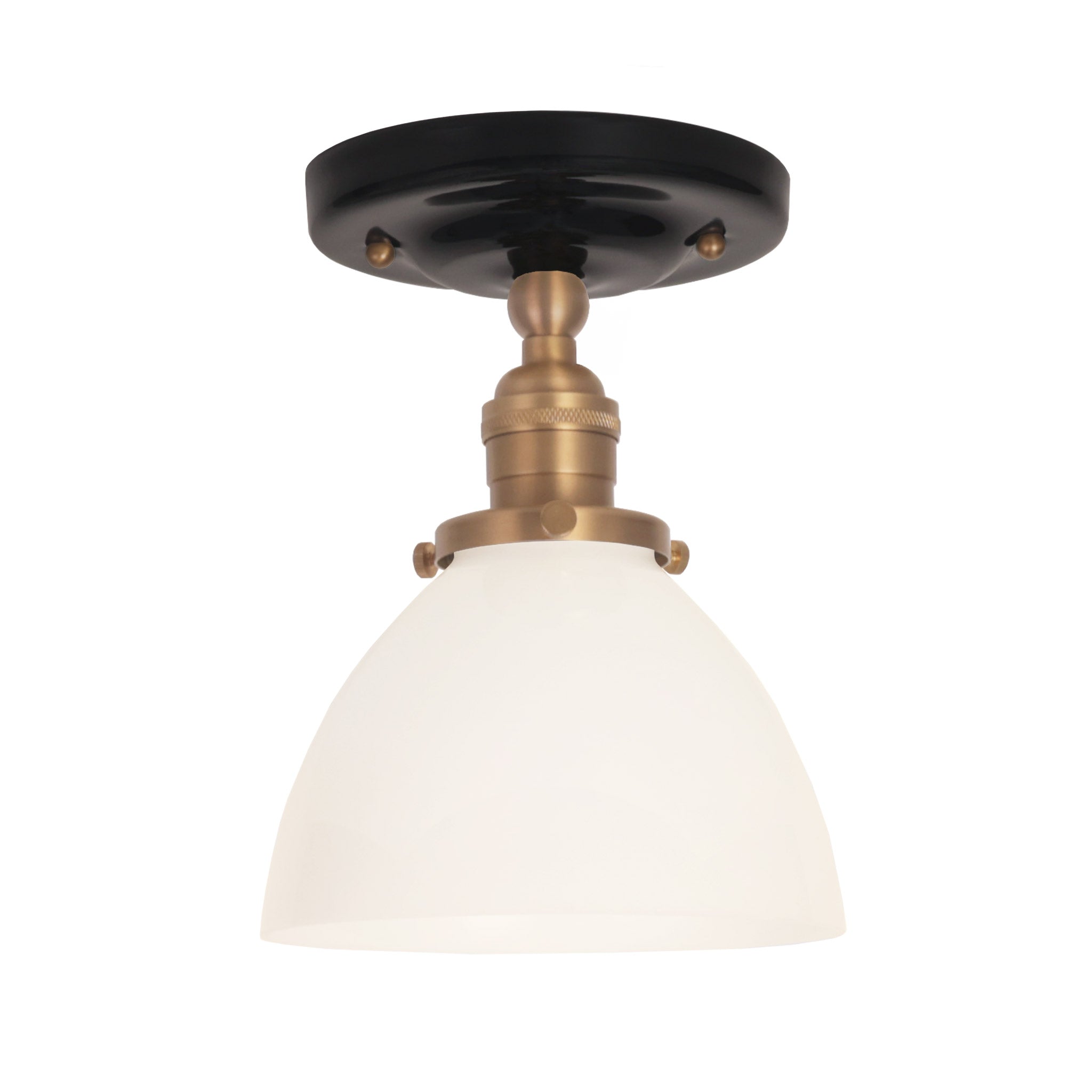 Grace Surface shown in Heirloom Brass with a Gloss Black Ceramic canopy and an Opal Glass shade