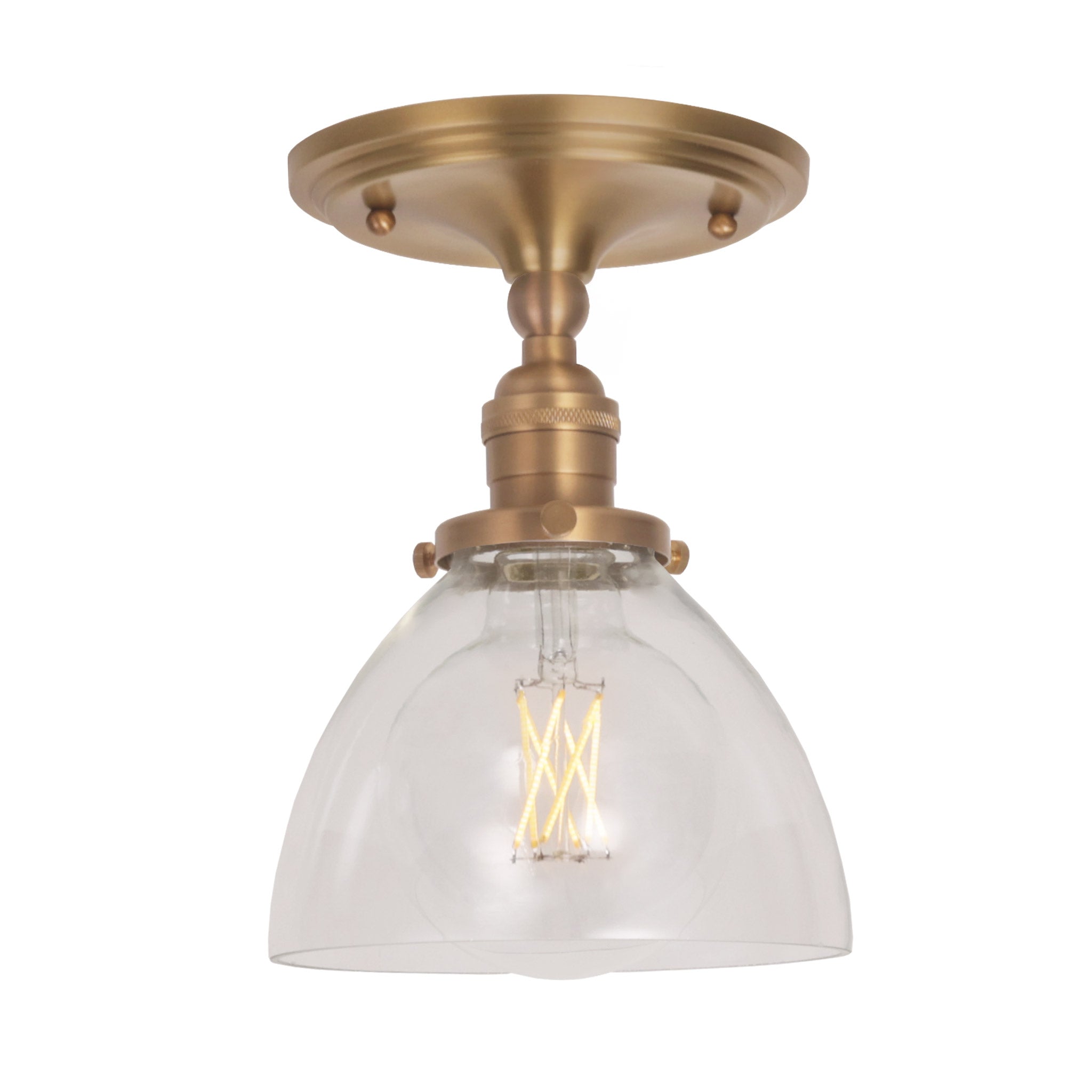 Grace Surface shown in Heirloom Brass with a Clear Glass shade