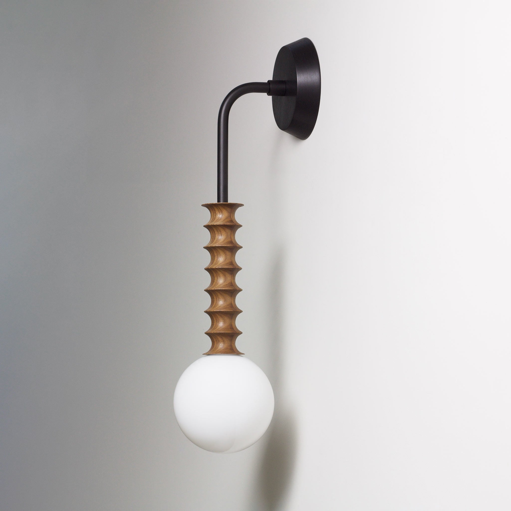 Joslyn shown in Walnut with Matte Black and a Black Stained canopy