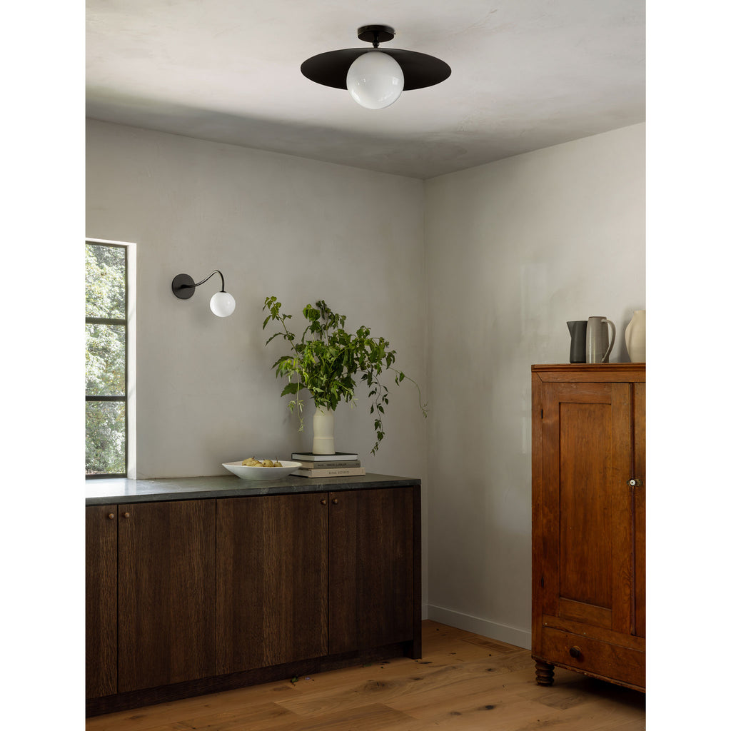 Marie Majeure Surface shown in Matte Black with a Josephine Wall Sconce.