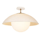 Maru Surface with a Natural shade shown in Heirloom Brass with a Bone Ceramic canopy