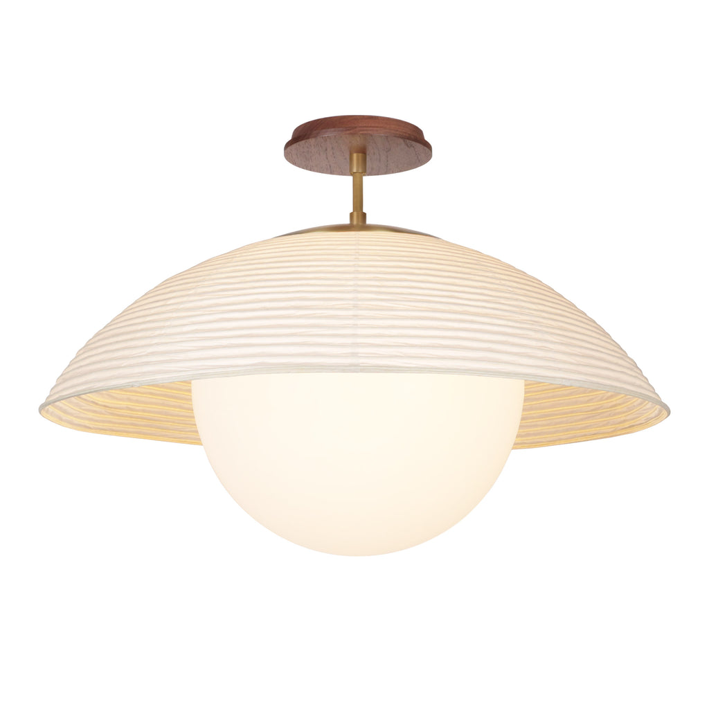 Maru Surface with a Natural shade shown in Heirloom Brass with a Walnut Wood canopy