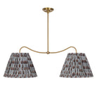 Oxford Grand Double Pendant shown in Heirloom Brass with Trulli Auburn Shades
