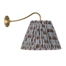 Oxford Grand Sconce shown in Heirloom Brass with a Trulli Auburn Shade