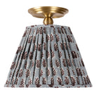 Oxford Surface shown in Heirloom Brass with a Trulli Auburn Shade