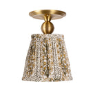 Oxford Surface shown in Heirloom Brass with a Winfleur Mustard Shade