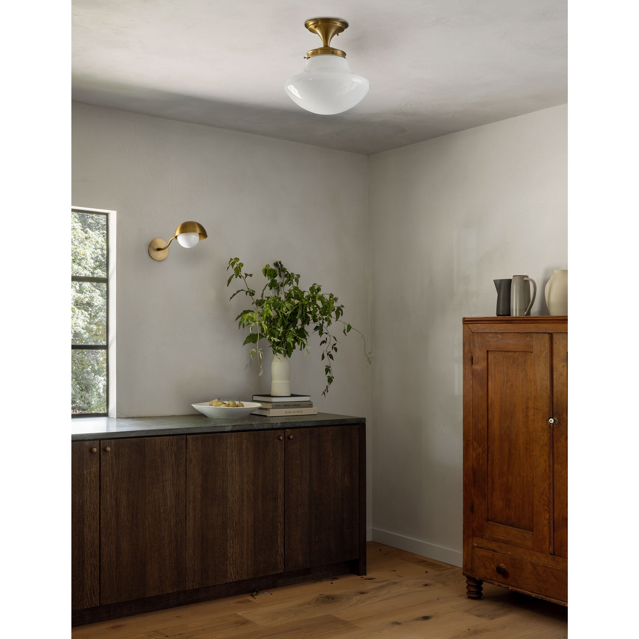 Sorbonne Surface 14" Tulip shown in Heirloom Brass with a Noor Curve Wall Sconce