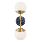 Theo shown in Brass with an Indigo Blue Sunflower Ceramic Canopy