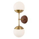 Theo shown in Heirloom Brass and a Walnut Wood Canopy