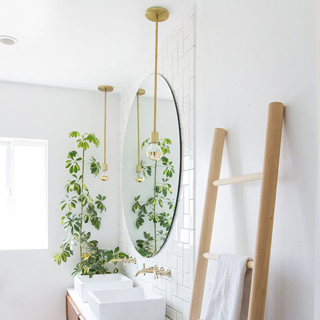 Timberline Rod Pendant shown in Brass. Interior design by Sarah Sherman Samuel for Smitten Studio