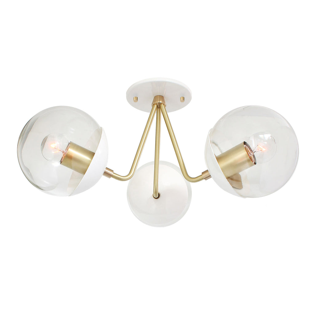 Trillium shown in White with Brass with 6" Clear globes