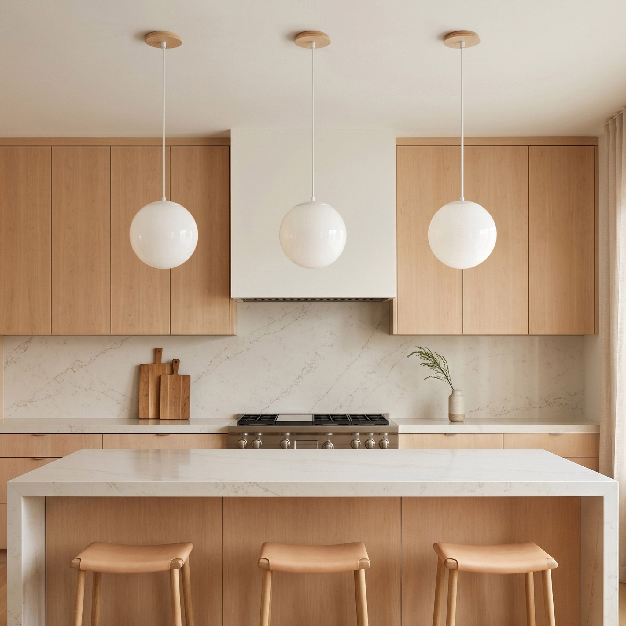 Alto Rod 10” Opal pendants shown in White with Maple Wood Canopies