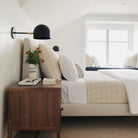 Amélie Sconce 8" in Matte Black with Brass. Interior Design by Casework Design