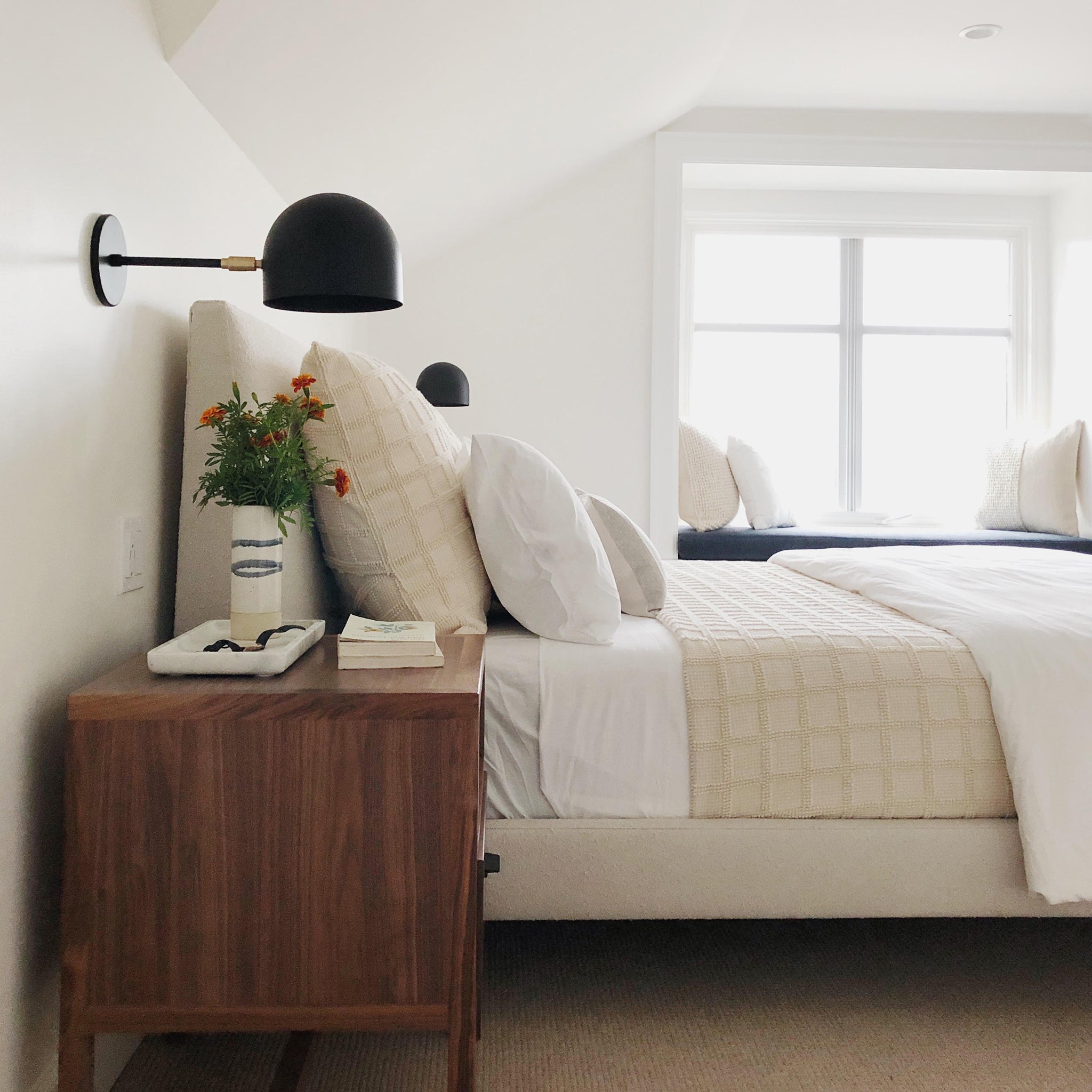 Amélie Sconce 8" in Matte Black with Brass. Interior Design by Casework Design