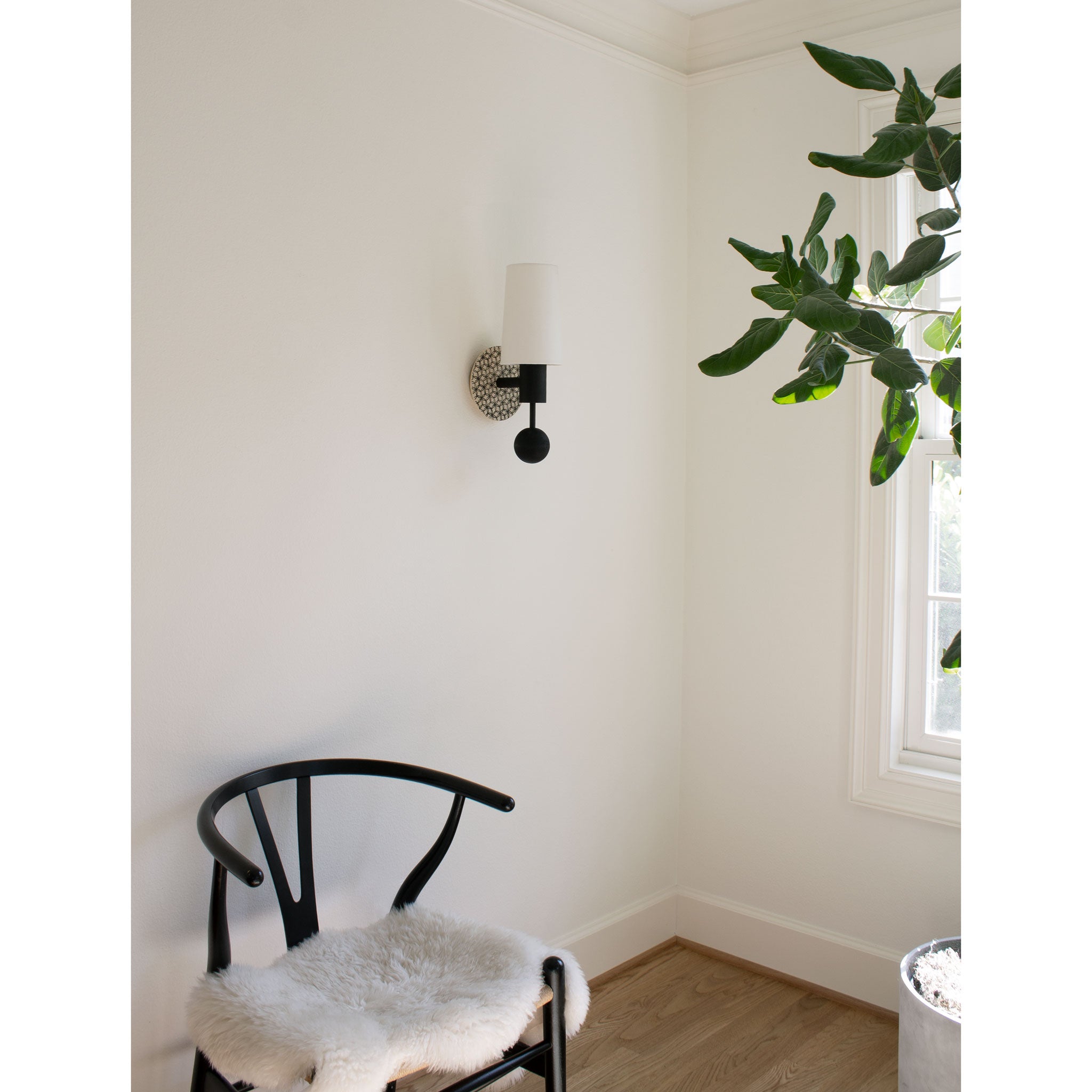 Amherst sconce shown in Black Stained with Black and Cream Quilted ceramic