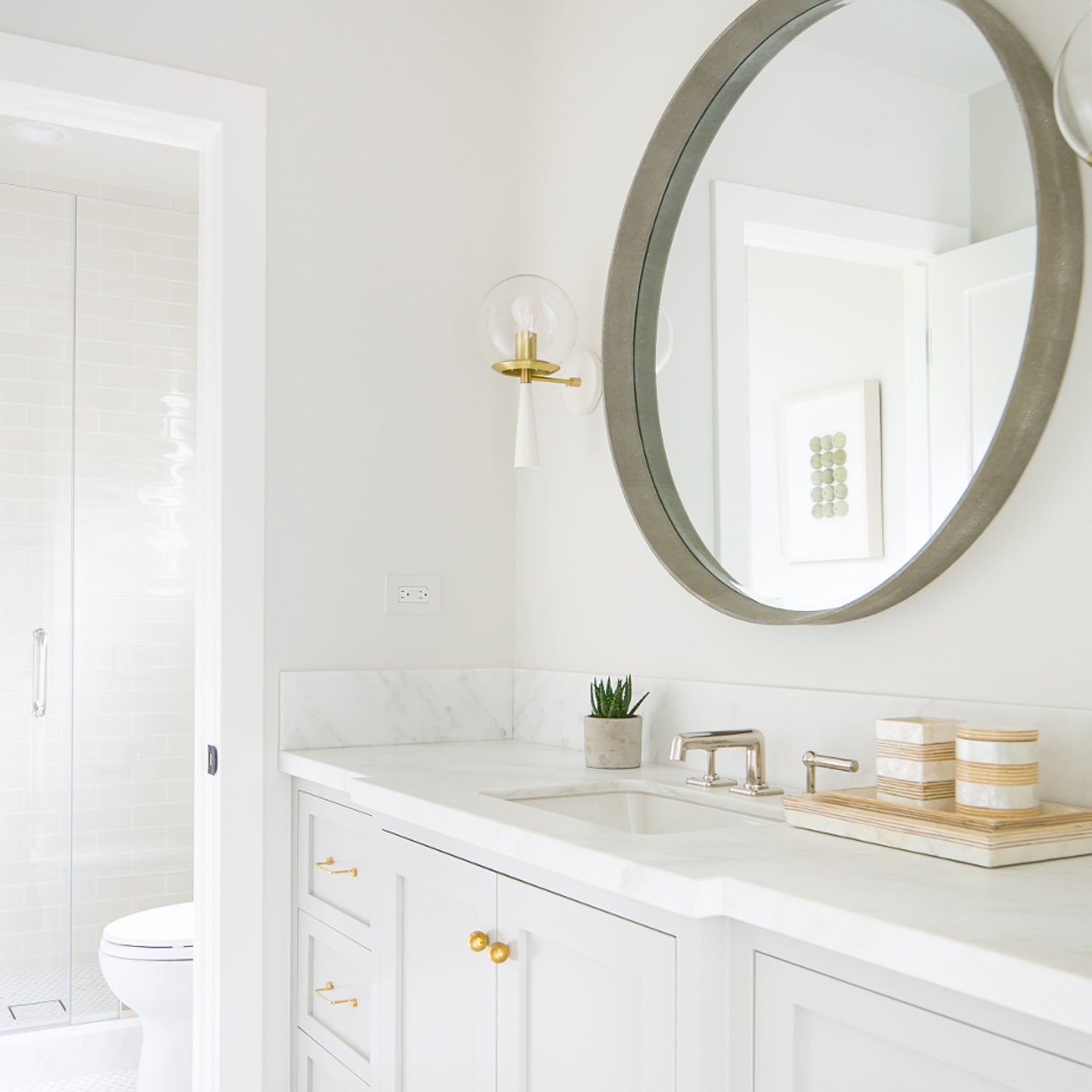 Audrey 8" shown in White with Brass with a Clear 8" globe. Interior design by Brooke Wagner Design