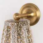 Cambridge Sconce shown in Heirloom Brass with a Winfleur Mustard Shade Detail