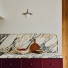 Marie Sconce shown in Heirloom Brass. Interior Design by Sarah Sherman Samuel. Photography by Daniel Peter