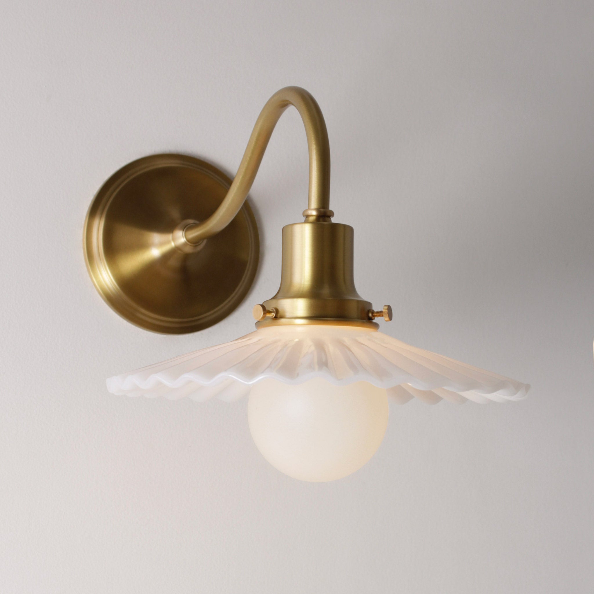 Marjorie Petite Sconce shown in Heirloom Brass