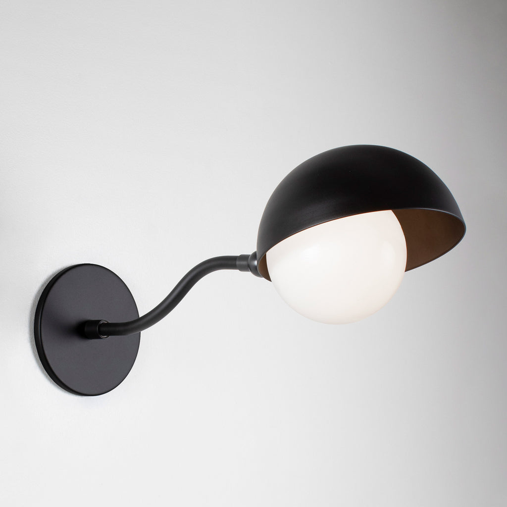 Noor Curve Sconce shown in Matte Black.