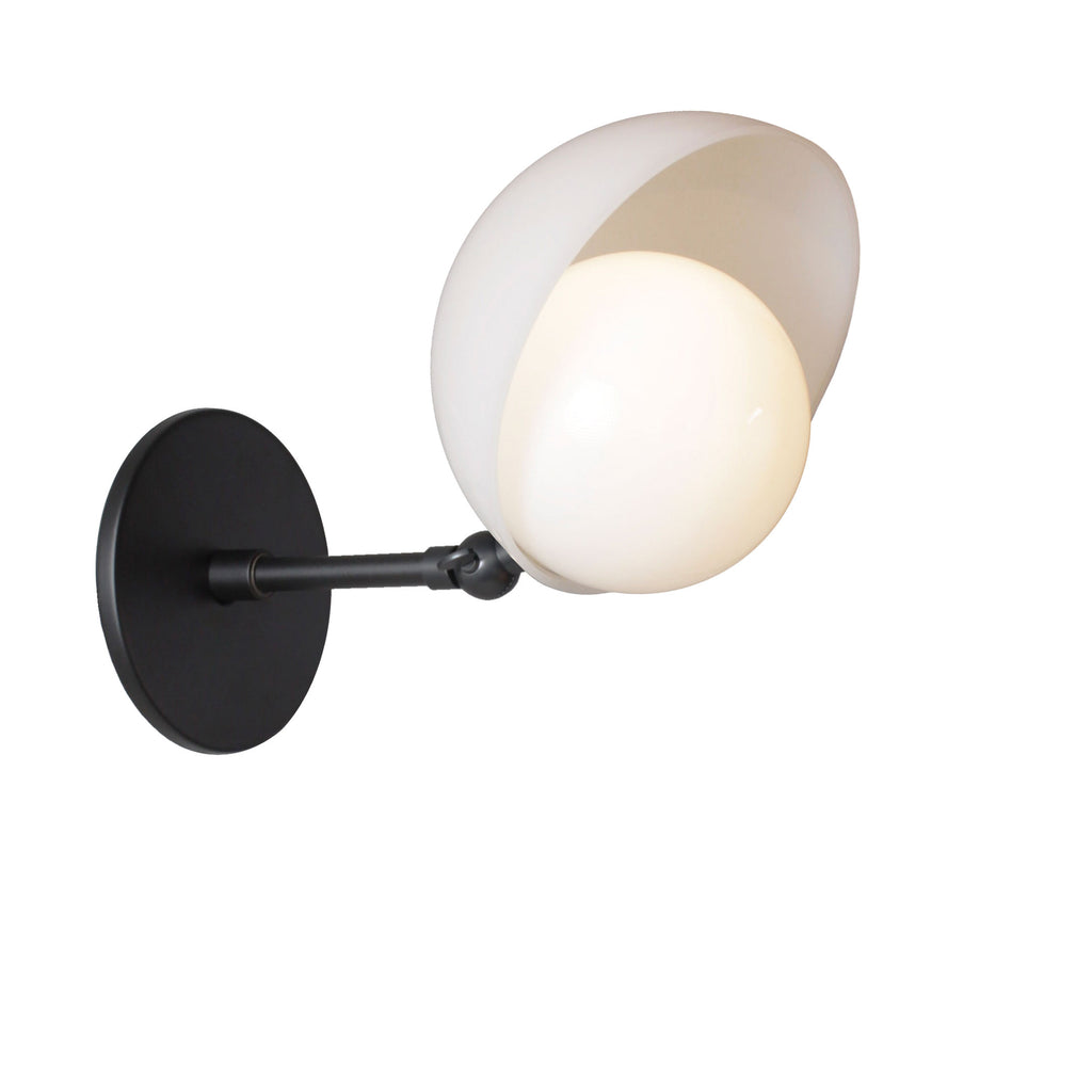 Noor Sconce shown with a White Opal Acrylic Shade, Brass Arm, and Matte Black Canopy.