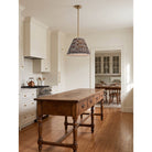 Oxford Pendant shown in Heirloom Brass with a Trulli Auburn Shade