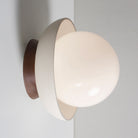 Terra Lexi shown in Bone ceramic and Walnut wood canopy