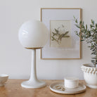 Aaro Lamp shown in Heirloom Brass