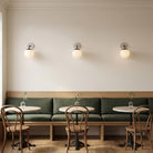 Alto Sconce 8” shown in Matte Black with a Brownstone White Sunflower Ceramic Canopy