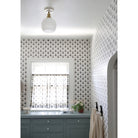 Beatrix Surface shown in Heirloom Brass with a Gloss White Ceramic Canopy