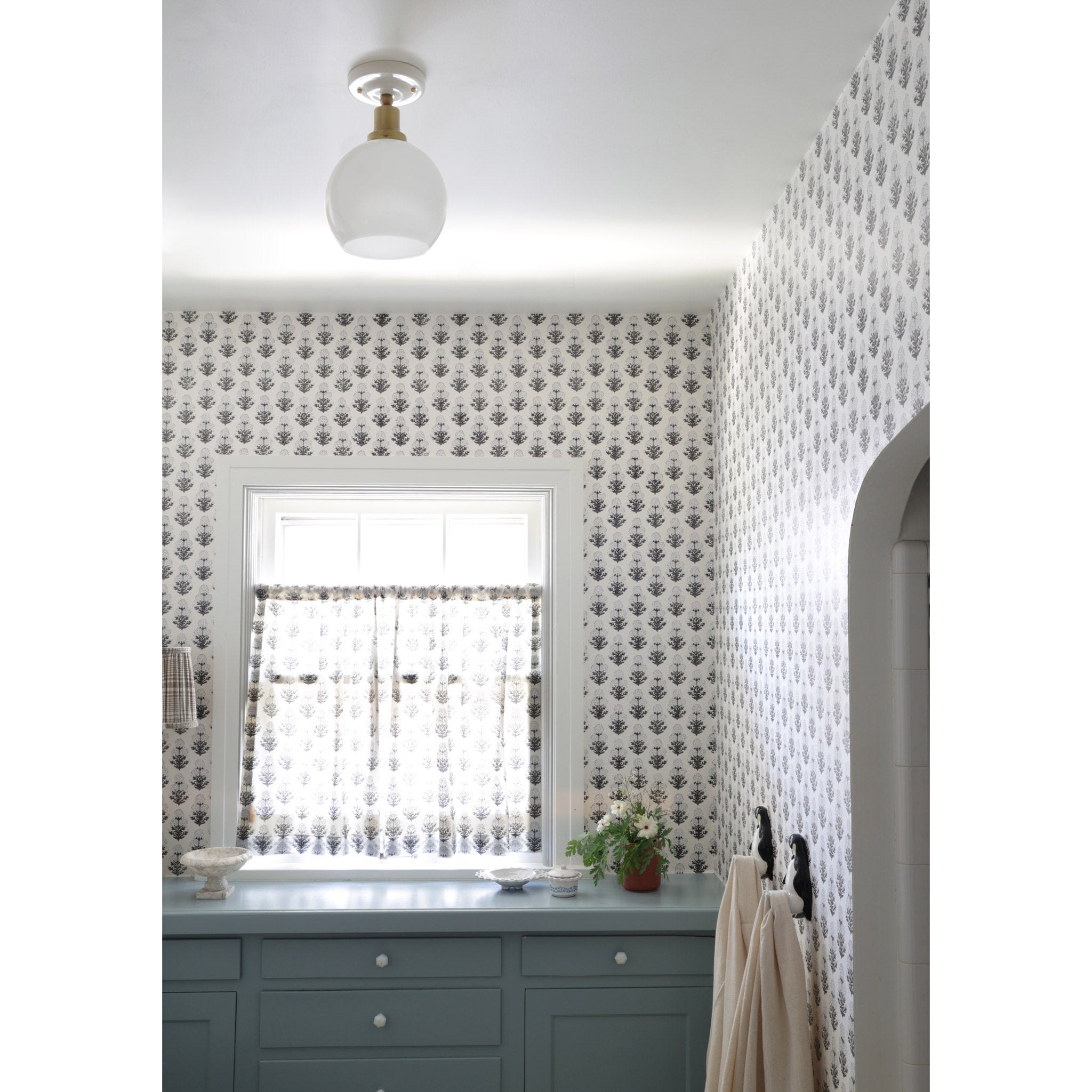 Beatrix Surface shown in Heirloom Brass with a Gloss White Ceramic Canopy