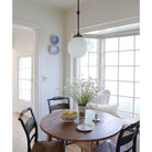 Bijou Pendant 10" Globe shown in Graphite Patina.  Interior design by Sarah J. Meyer Design