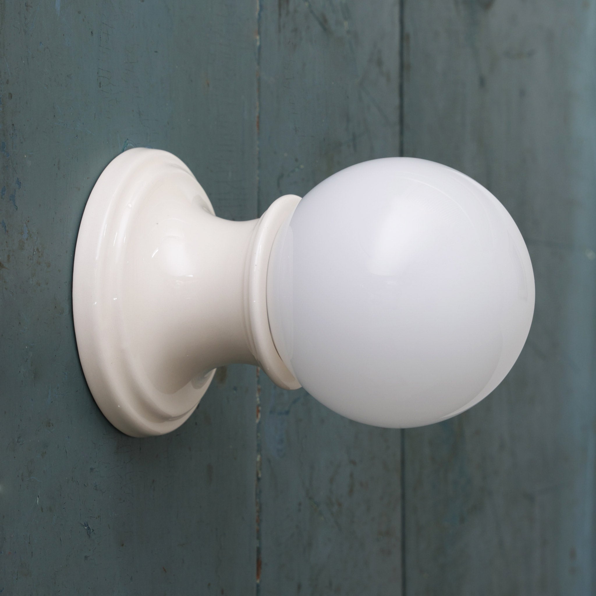 Emma Globe Sconce shown with Gloss White Glaze