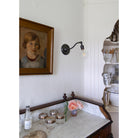 Grace Sconce shown in Graphite Patina with no shade and a G30 Filament Bulb. Interior design by Sarah J. Meyer Design