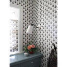 Grace Linen Sconce shown in Graphite Patina with a Gloss White Ceramic canopy shown with Marigold wallpaper and fabric from Filling Spaces 