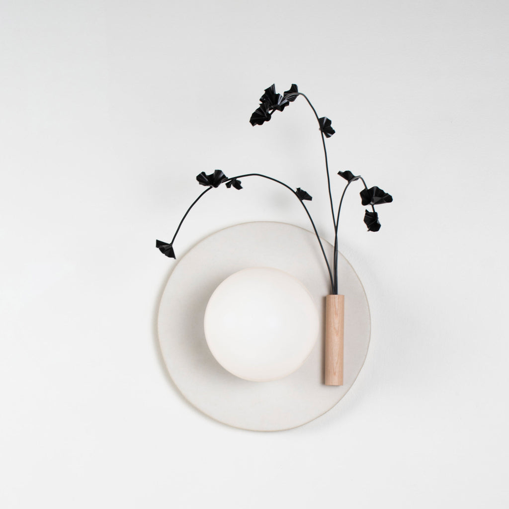 Ikebana Sconce shown in Natural White Glaze with Graphite Patina flower finish and Right mounted vase.