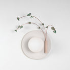 Ikebana Sconce shown in Natural White Glaze with Verdigris flower finish and Right mounted vase