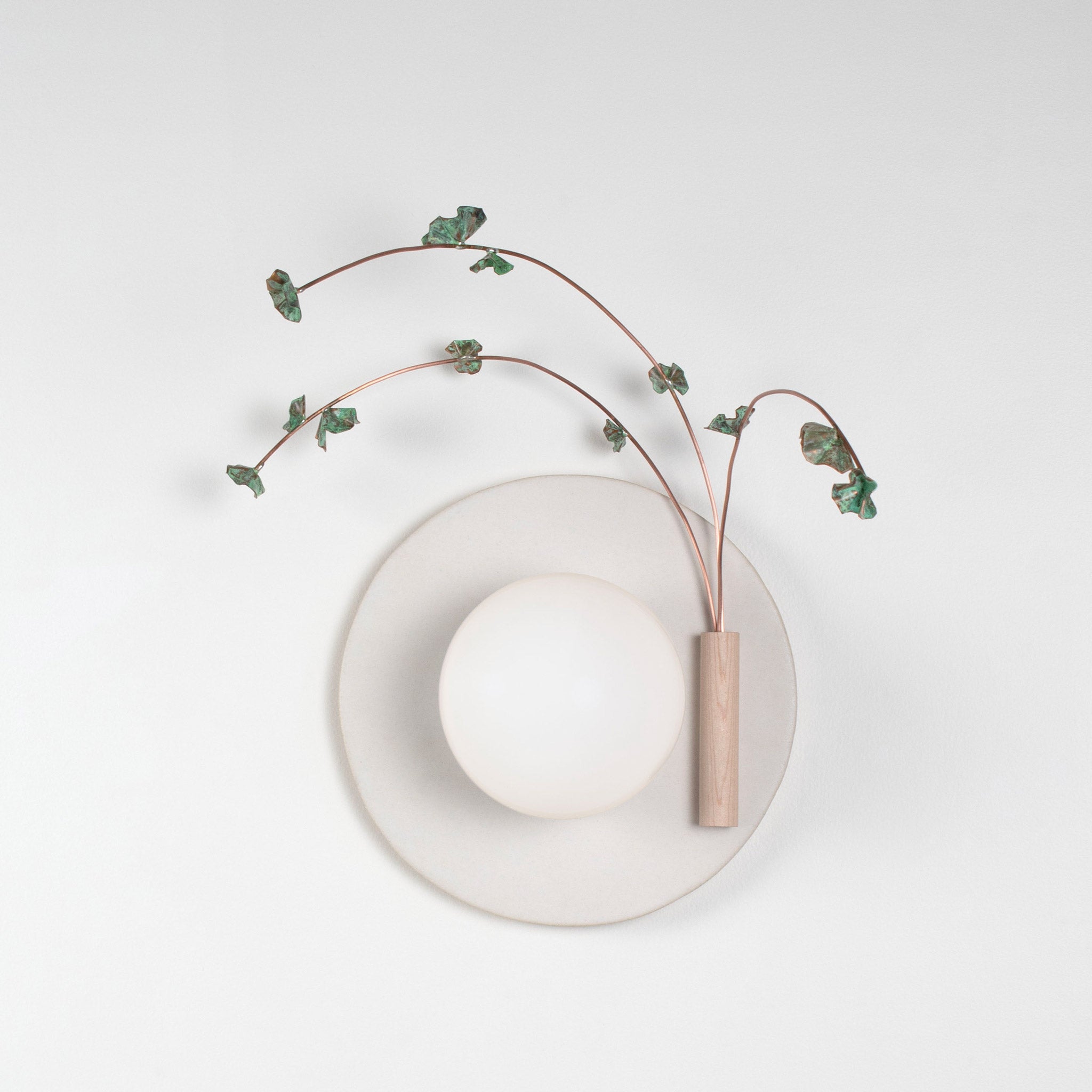Ikebana Sconce shown in Natural White Glaze with Verdigris flower finish and Right mounted vase