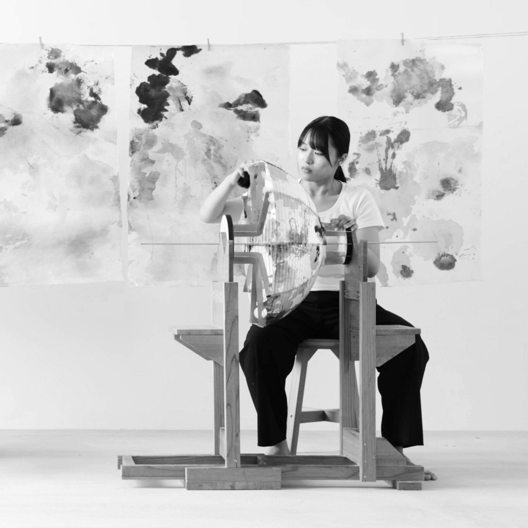 Artisan handcrafting a Maru shade with hand-painted Sumi washi paper