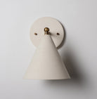 Petra Ceramic Sconce shown in Heirloom Brass with a 3" rod and Bone Ceramic canopy